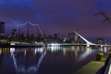 buenos aires, argentina. puerto madero by night. it's a district at buenos aires, occupying a portion of the río de la plata riverbank and representing the latest architectural trends in buenos aires