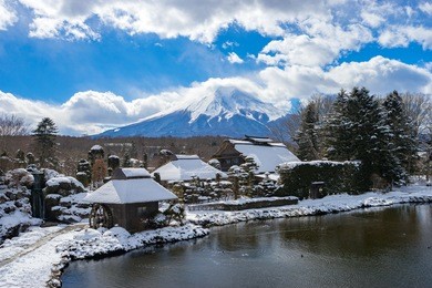 oshino hakkai, a small village in the fuji five lake region with mt. fuji in the background. located on the sixth lake that dried out. 