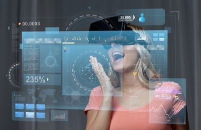 technology, augmented reality, cyberspace, entertainment and people concept - happy amazed young woman with virtual headset or 3d glasses at home and screen projection