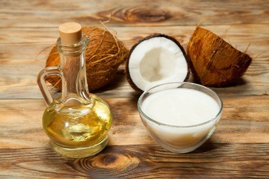 coconut oil, coconut on a wooden background