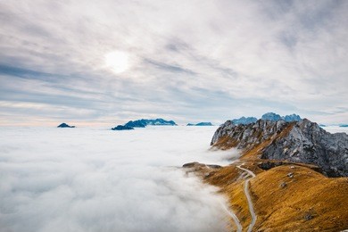 amazing view from mangart, located between italy and slovenia. in the background with foggy peaks of triglav mountains.. 