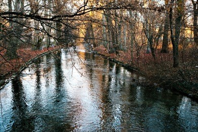 wonderful autumnal view of the river " eisbach " in the english garden in munich, bavaria, germany, europe. 