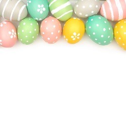 top border of hand painted pastel easter eggs over a white background