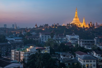 beautiful illuminated golden shwedagon pagoda (shwedagon zedi daw) at dawn or twilight time, famous landmark and travel destination of yangon, myanmar (burma)