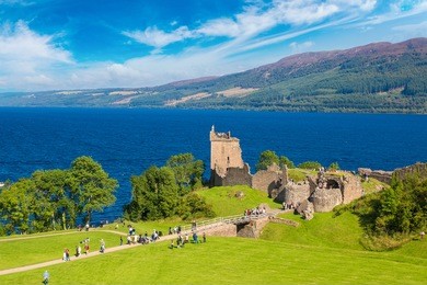 urquhart castle along loch ness lake in scotland in a beautiful summer day, united kingdom