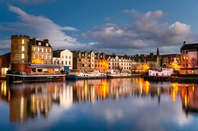 old leith docks at dusk and reflection in water. edinburgh, scotland.