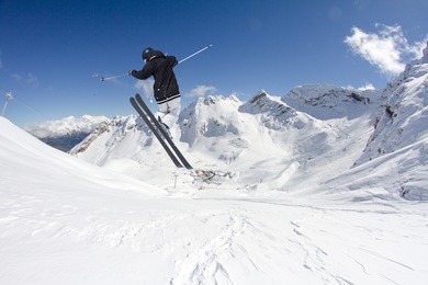 flying skier on mountains. extreme sport.