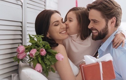 nice pleasant girl kissing her mother