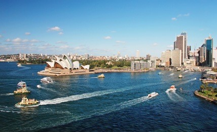 sydney opera house with ferrys in foregournd, taken from harbor bridge