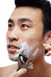 man shaving face