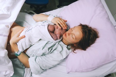 mother giving birth to a baby boy.