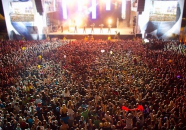 big crowd before stage at a live concert of a famous rockband