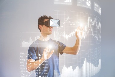 person wearing virtual reality (vr) headset or head-mounted display (hmd) glasses to interact with financial dashboard with stock market key performance indicators (kpi) and business intelligence (bi)