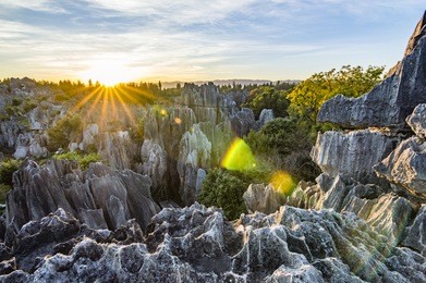 beautiful sunset in stone forest in shilin, kunming, yunnan province, china