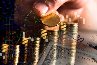 hand putting money coins stack in finance and banking concept.