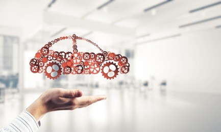 man presenting in palms concept of car transporation or insurance