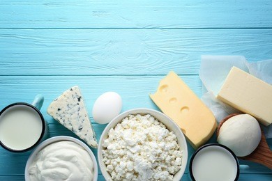 fresh dairy products on blue wooden background