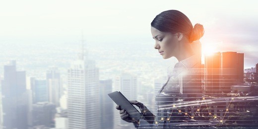 attractive business lady working on tablet    . mixed media