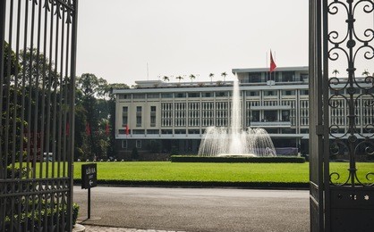 open gate view of reunification palace, landmark in ho chi minh city, vietnam or independence palace (dinh thong nhat) 