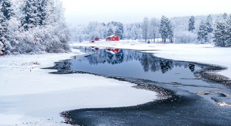 norwegian landscape with typical scandinavian red house. winter scene
