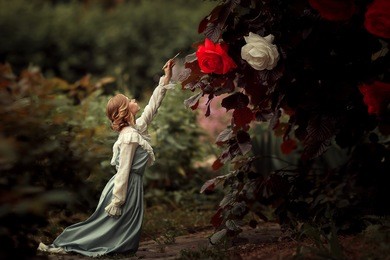 the girl in the blue dress in the garden