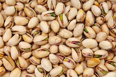 nuts. green fresh pistachios as texture.