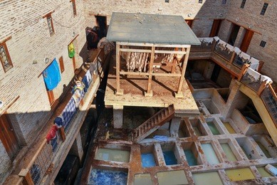 small leather traditional tannery in ancient medina of fes el bali. fez, morocco