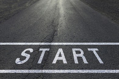 sunny start line racing background on asphalt floor.