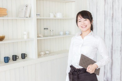 asian woman working  at a cafe