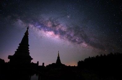 milky way with two pagoda in doi inthanon mountain, chiang mai,thailand