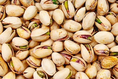nuts. green fresh pistachios as texture.