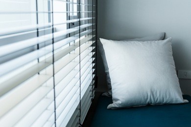 contemporary interior of living room with part of sofa in sunny day and white curtain interior background concept