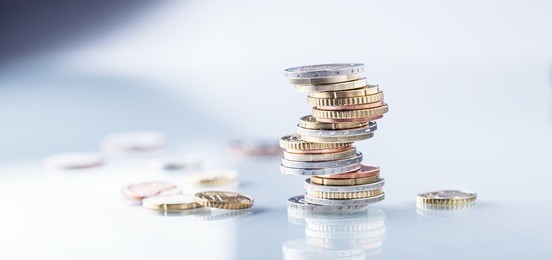 euro coins stacked on each other in different positions.