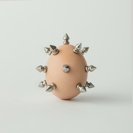 easter egg with metal thorns. minimal concept.