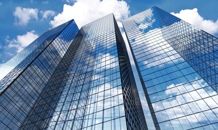 skyscrapers with clouds reflection