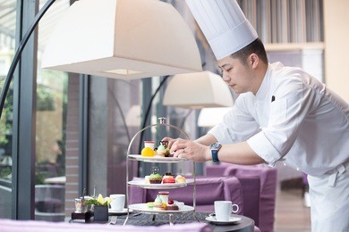 young chinese man chef making delicious food 