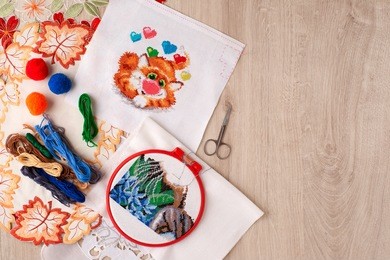 embroidery and embroidery frame. embroidery, as a kind of creativity and needlework. view from above. the embroidery frame and thread are needed for creativity. handmade from bright materials.