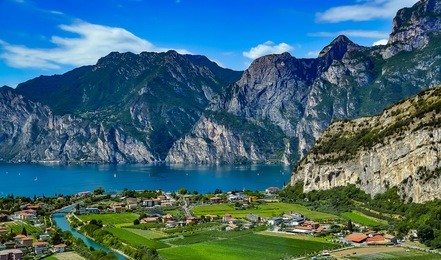 panorama of the gorgeous lake garda surrounded by mountains in riva del garda, italy. lake garda italy