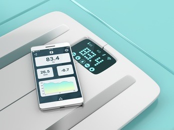 smart weight scale and a smartphone with weight information on it's display. 3d illustration