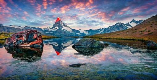 colorful summer panorama of the stellisee lake. few minutes before sunrise. great outdoor scene with matterhorn (monte cervino, mont cervin) in swiss alps, switzerland, europe.