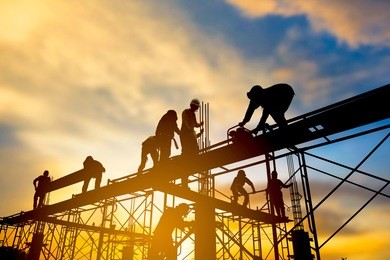 silhouette the group of workers working at a construction site.construction workers work in preparation for binding rebar and concrete work