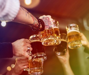 group of people celebrate party with beer