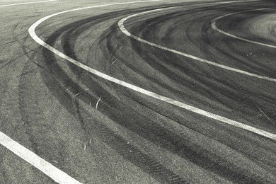 tracks of tires on a speedway