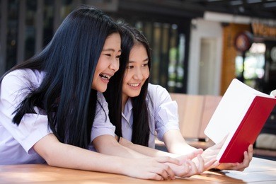 two asia thai high school student uniform best friends beautiful girl reading book
