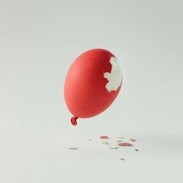 red easter egg balloon on bright white background. minimal creative concept. flat lay.
