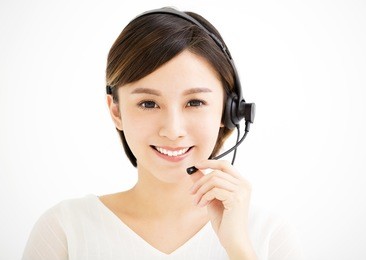 smiling young business woman with headsets