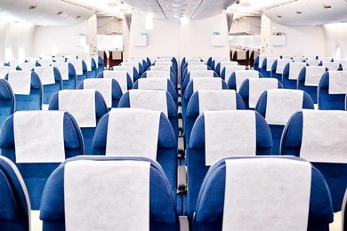 empty airplane seats in the cabin