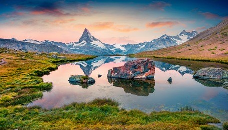 colorful summer panorama of the stellisee lake. few minutes before sunrise. great outdoor scene with matterhorn (monte cervino, mont cervin) in swiss alps, switzerland, europe.