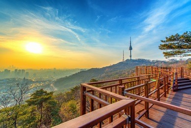 view of sunset in seoul city with seoul tower at namsan public park.
