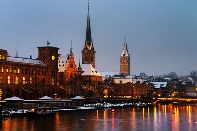 zurich, switzerland. illuminated st. peter church and old clock tower is one of the symbols of the city and major touristic attraction in zurich, switzerland. night sky